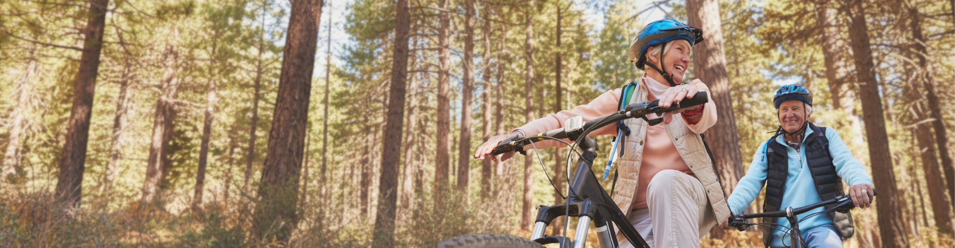 senior people biking in the woods senior people biking in the woods